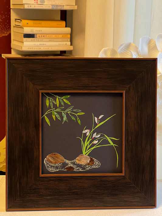 Original Raden shell art Lan Zhu Shuang Qing by Showing Studio in a 35x35cm walnut frame, showing deep green abalone bamboo leaves, ivory mother of pearl orchids and textured tiger shell rocks.