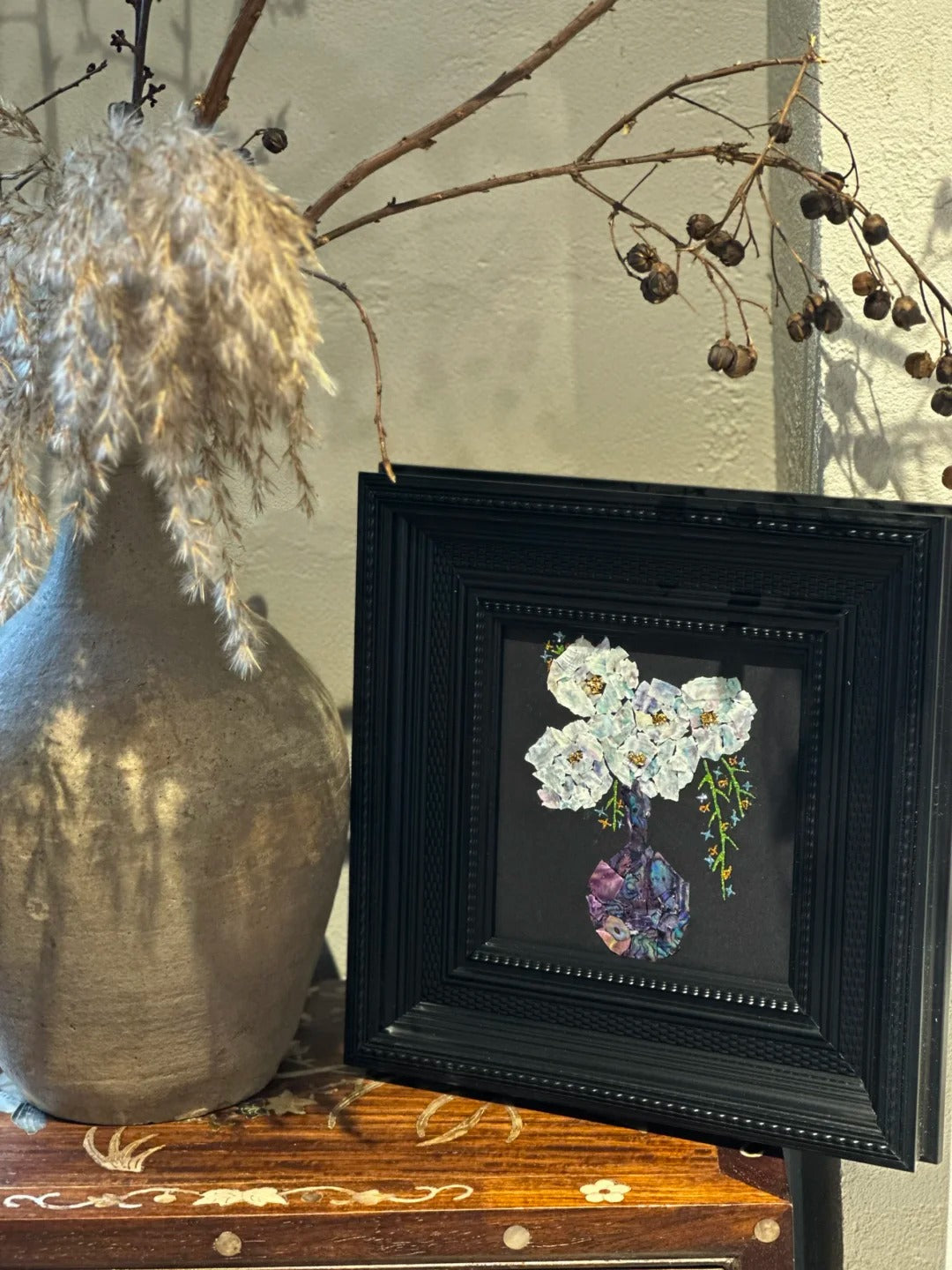 Close-up details of natural mother of pearl shell inlay craft, iridescent shell texture in lacquer art, fine oriental craftsmanship.