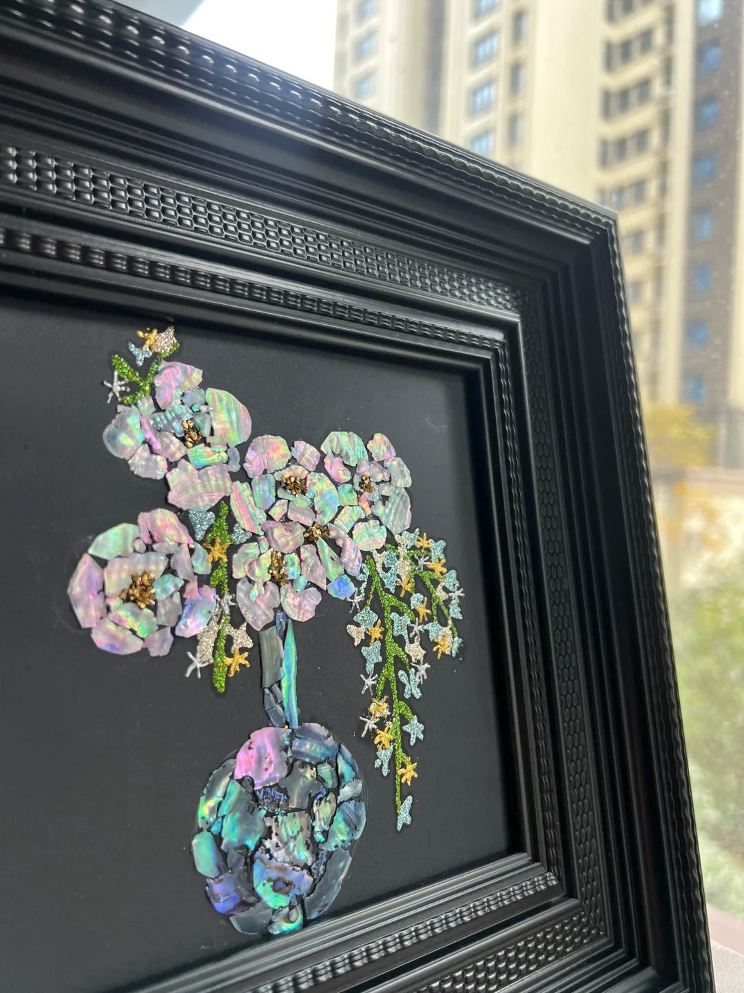 Close-up details of natural mother of pearl shell inlay craft, iridescent shell texture in lacquer art, fine oriental craftsmanship.