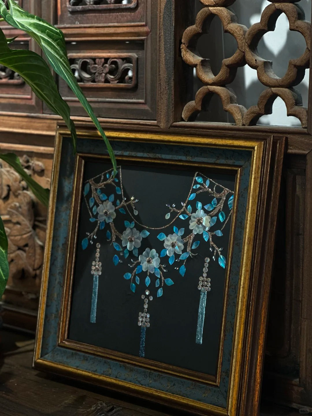 Close-up of Dunhuang style shell inlay craft, iridescent mother of pearl cloud pattern, luxury oriental interior decor detail.