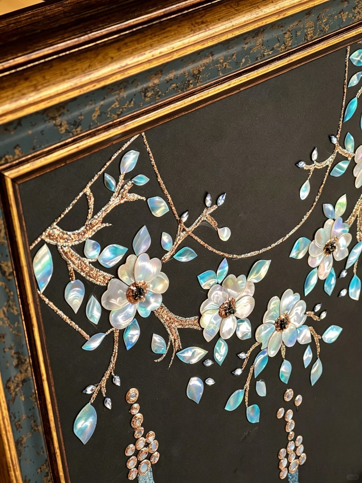 Close-up of Dunhuang style shell inlay craft, iridescent mother of pearl cloud pattern, luxury oriental interior decor detail.