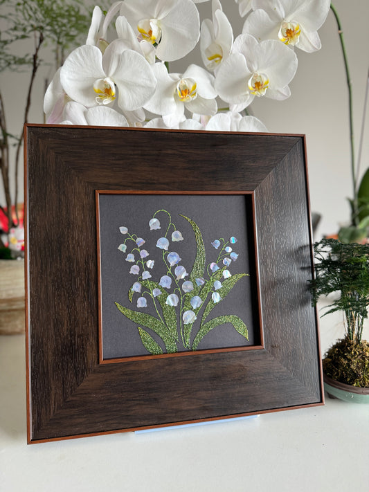 Handcrafted "Whispers of Lily" mother-of-pearl wall art, 20x20cm floral inlay, luxury botanical Zen home decor.