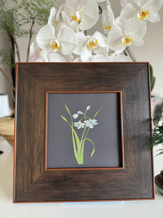 Handcrafted mother-of-pearl inlay artwork "Luo Shen Fu" featuring minimal, elegant narcissus water daffodil flowers on a matte black canvas, housed in a luxurious wide dark wood frame.