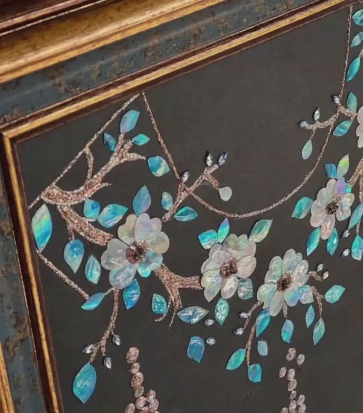 Close-up of Dunhuang style shell inlay craft, iridescent mother of pearl cloud pattern, luxury oriental interior decor detail.